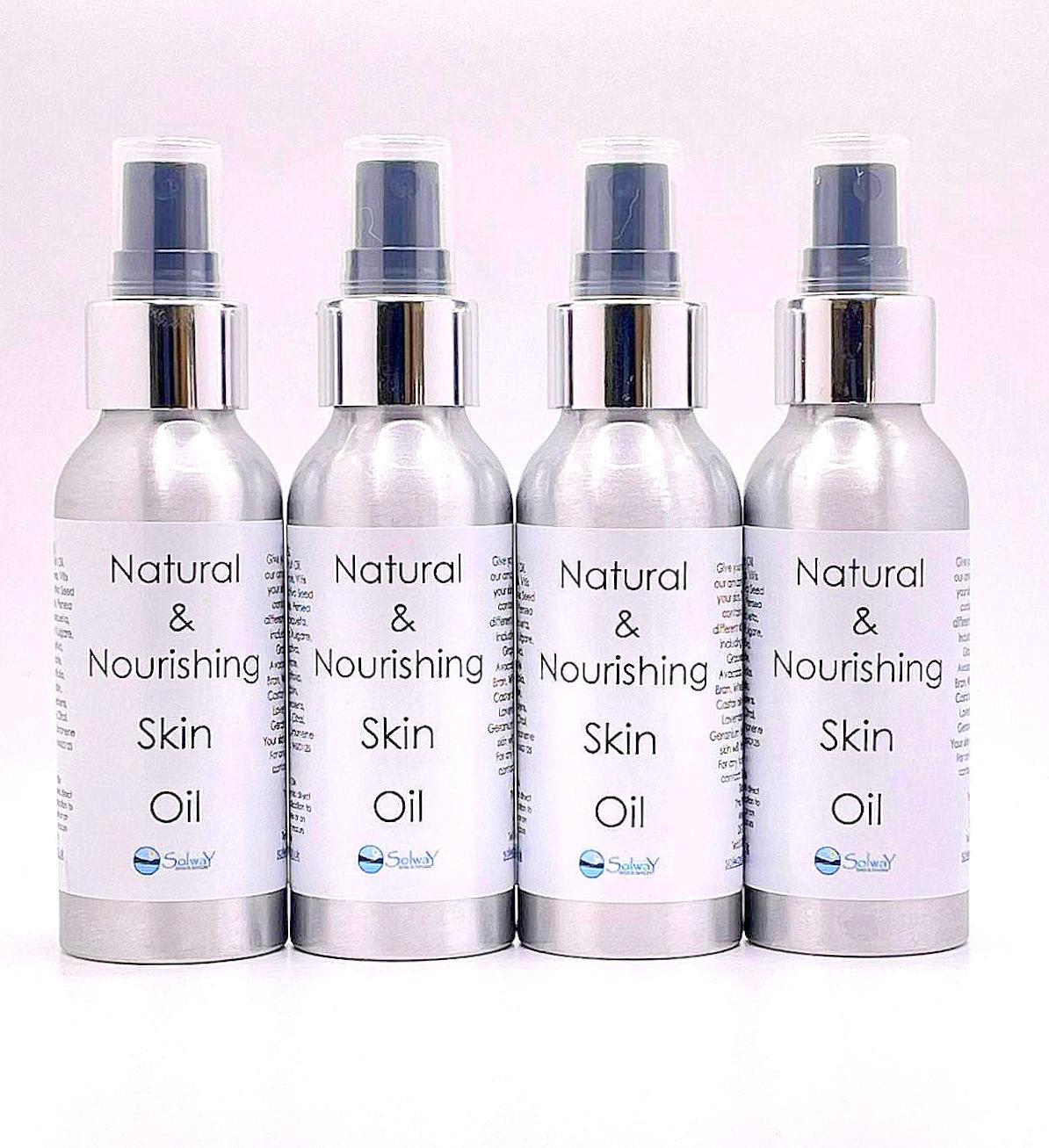 4 bottles of natural and nourishing skin oil in silver bottles with silver and black spray top