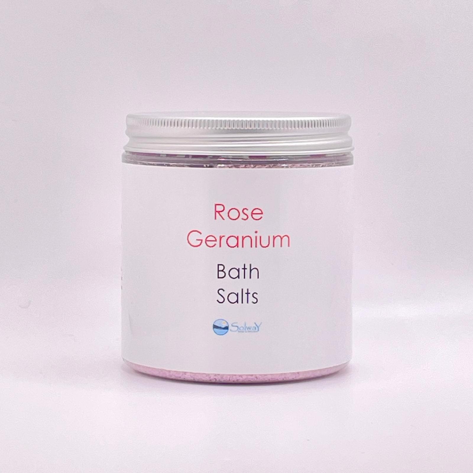 large jar of rose geranium bath salts with silver lid-pink coloured with a white label on white background